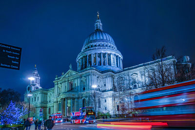 Illuminated building against sky at night