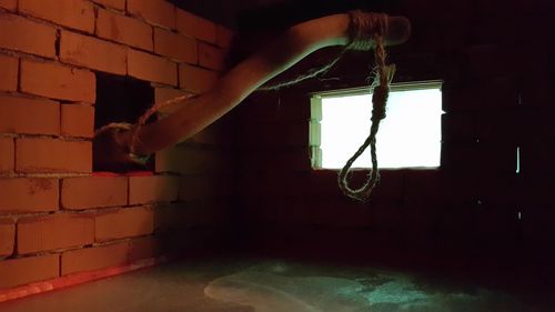 Low section of woman on wall