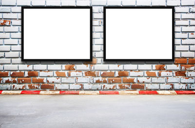 Empty seats against wall in city