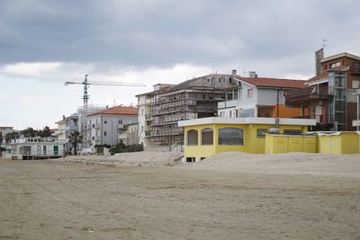 Buildings in city against sky