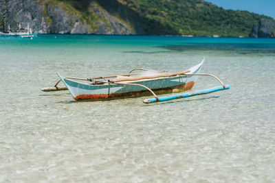 Boat moored on shore