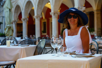 Portrait of woman sitting in restaurant