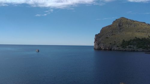 Scenic view of sea against blue sky