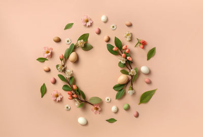 High angle view of christmas decorations on pink background