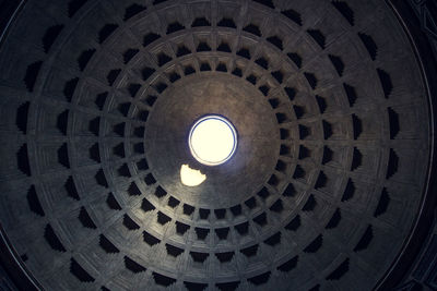 Low angle view of illuminated light hanging from ceiling