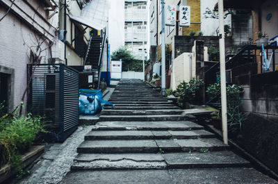 Steps amidst buildings in city