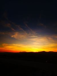 Scenic view of silhouette landscape against sky during sunset