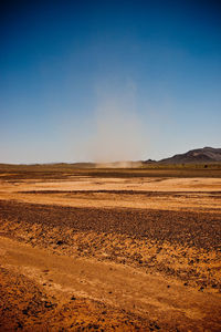 Scenic view of desert against clear sky