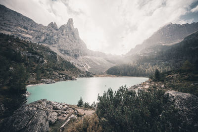 Scenic view of lake and mountains against sky