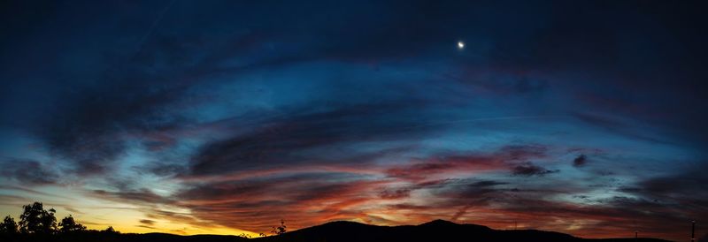 Low angle view of dramatic sky at night