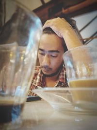 Portrait of a man drinking water from glass
