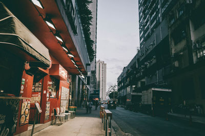 Street amidst buildings in city against sky