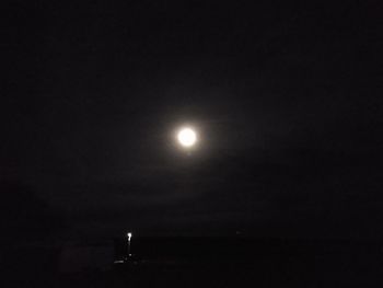 Low angle view of moon against sky at night