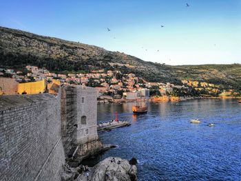 High angle view of the calm bay against mountain and sky