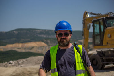 Portrait of man standing against sky