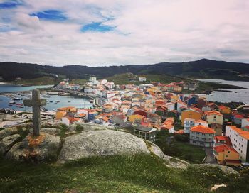 Scenic view of river by mountains against sky