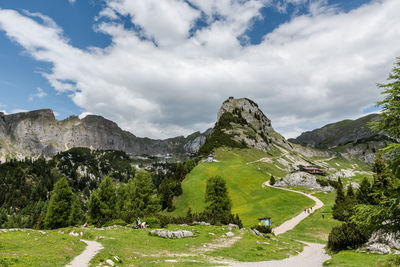 Scenic view of mountains against cloudy sky