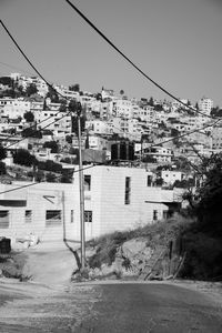 Buildings in city against clear sky