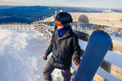 Man wearing warn clothing while standing outdoors during winter