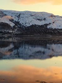 Scenic view of lake against sky during sunset