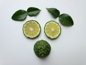 Directly above shot of fruits against white background