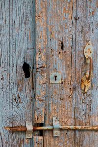 Full frame shot of weathered locked door