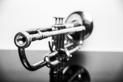 Close-up of faucet against black background