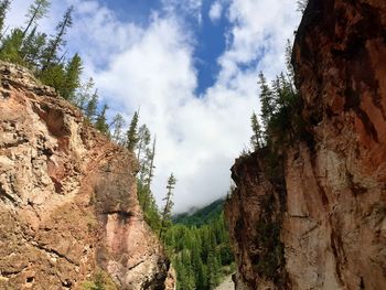 Low angle view of rocks against sky