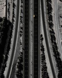 Aerial view of yellow car on road