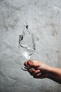 Close-up of hand holding wine glass