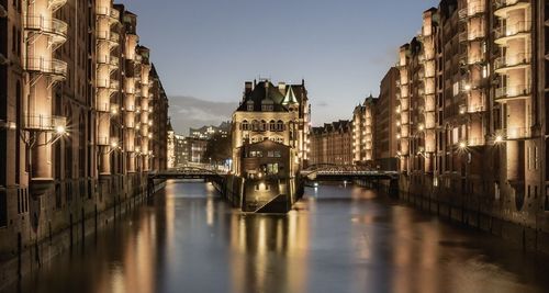 Canal amidst buildings in city