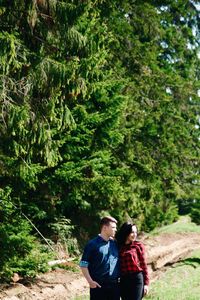 Young couple standing in forest