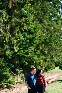 Young couple standing in forest