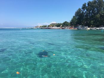 Scenic view of sea against blue sky