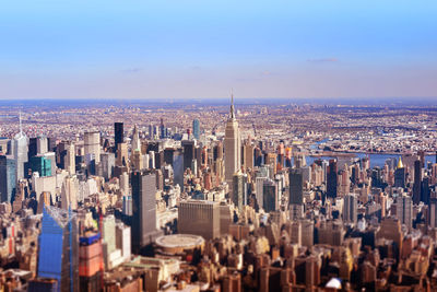 Aerial view of modern buildings in city against sky