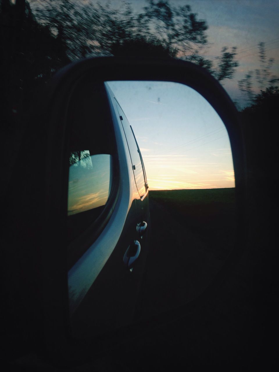 transportation, mode of transport, land vehicle, car, sunset, side-view mirror, reflection, sky, silhouette, road, travel, vehicle interior, car interior, on the move, street, part of, nature, glass - material, cropped, outdoors