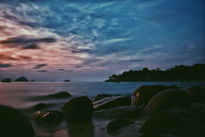 Scenic view of sea against cloudy sky