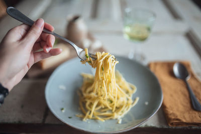 Personal perspective of pasta on fork