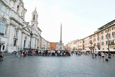 People in front of historical building