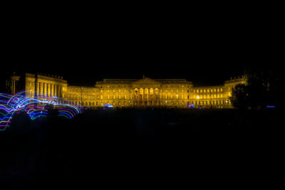 Illuminated city lit up at night