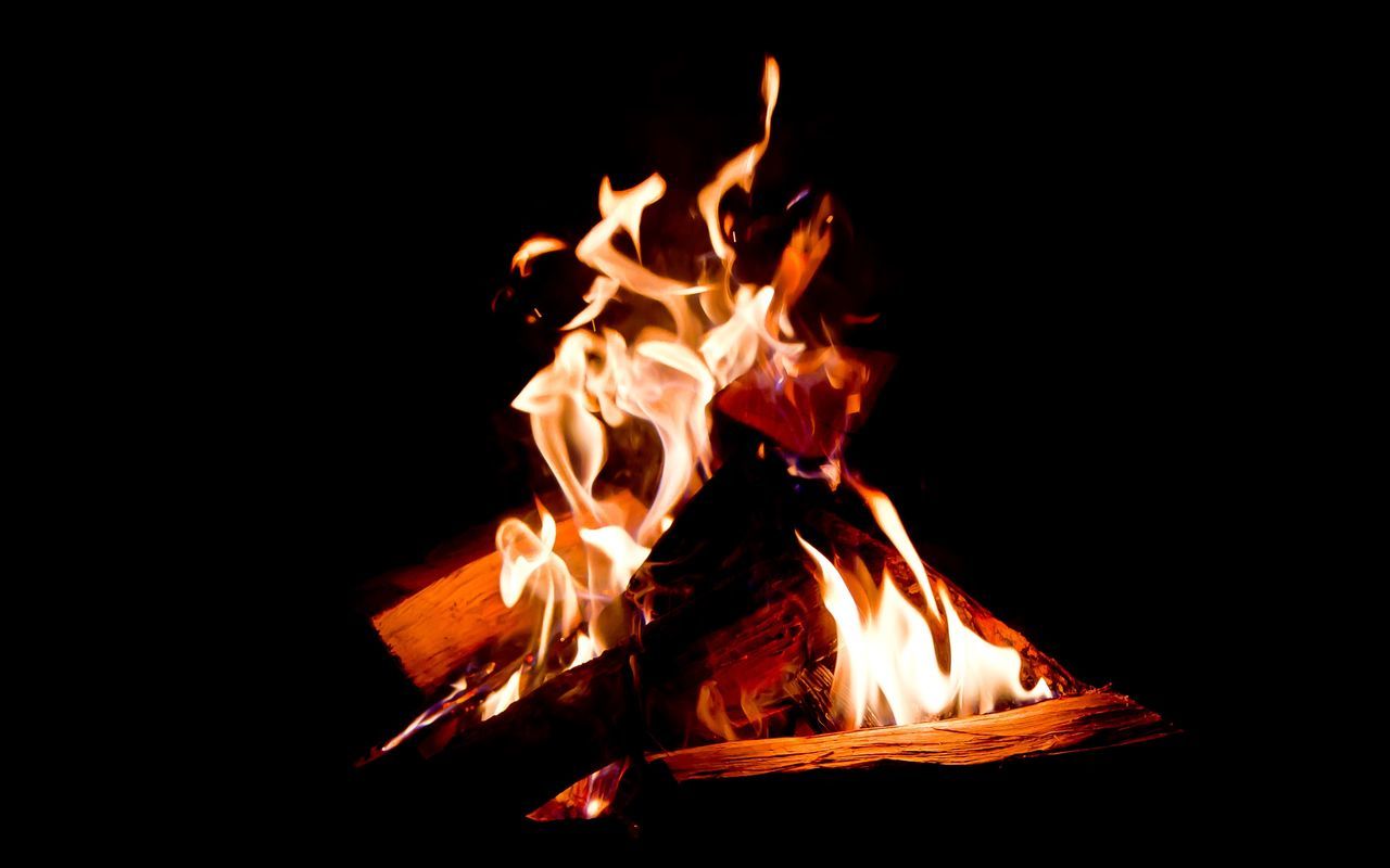 burning, flame, fire - natural phenomenon, heat - temperature, bonfire, firewood, night, glowing, fire, campfire, heat, wood - material, close-up, dark, orange color, log, motion, copy space, no people, fireplace