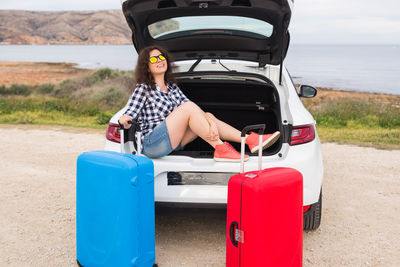 Portrait of woman sitting in car