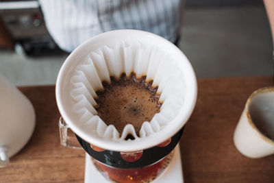 Barista dripping coffee and slow coffee bar style