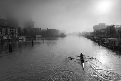 Boat on canal in a foggy day
