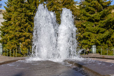 Water flowing through fountain in park