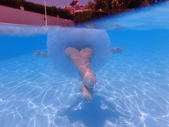 Woman swimming in pool