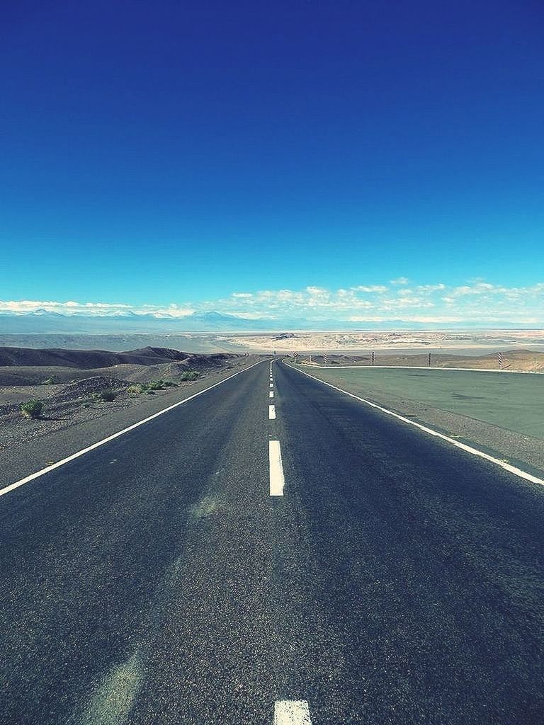 the way forward, road marking, road, transportation, diminishing perspective, vanishing point, blue, asphalt, country road, landscape, empty, copy space, empty road, sky, clear sky, long, tranquil scene, surface level, tranquility, dividing line