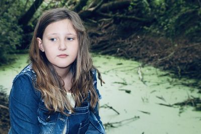 Portrait of cute girl standing outdoors