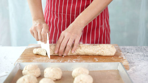 Man preparing food on table in kitchen