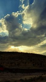 Scenic view of dramatic sky over land